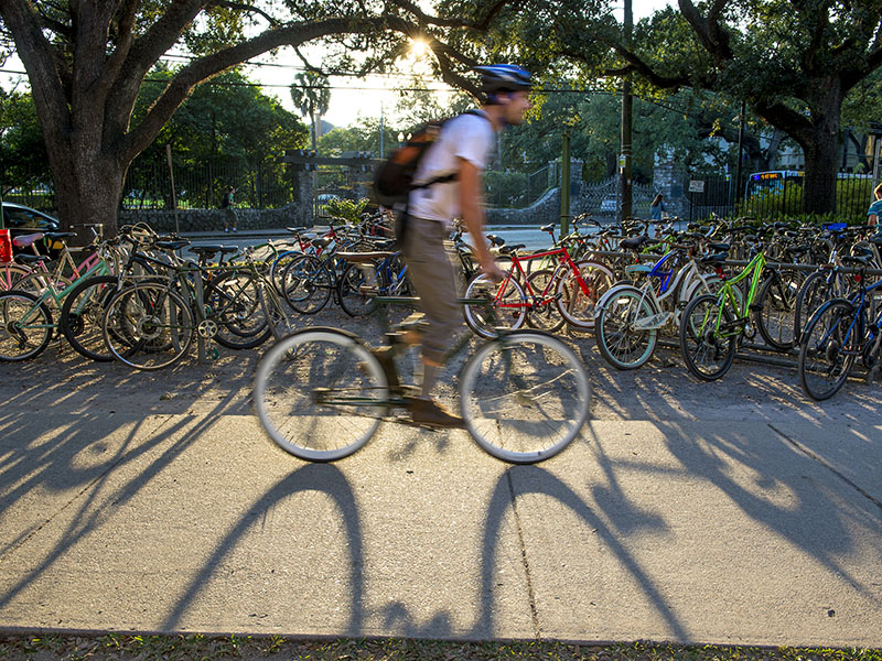 Student rides bike on uptown campus